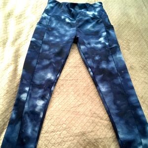A pair or dark blue tie dye Sho Sho leggings size L with dual side pockets!